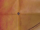 a folded piece of paper with a picture of a person on it