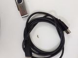 a remote and a charger sitting on a table