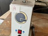 a machine that is sitting on top of a wooden table