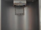 an image of a stainless steel refrigerator with a water dispenser