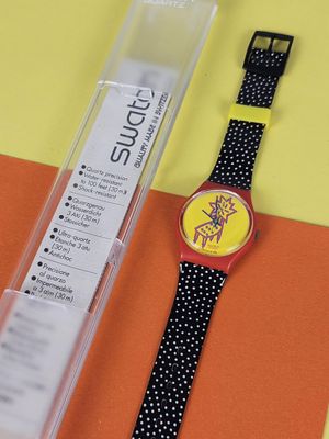 a watch that is sitting on top of a piece of paper