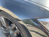 a close up of a car ' s front wheel and tire