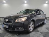 a picture of a black chevrolet malibu parked in a garage