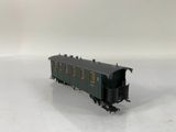 a black train car that is sitting on a white surface