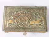 an antique brass box with an image of a man and a woman riding on horses