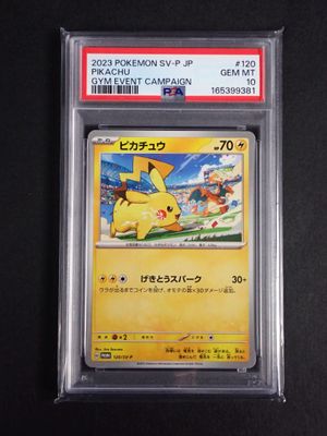 a close up of a pokemon card on a black surface