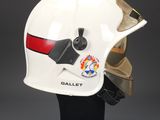 a close up of a helmet on a stand on a black surface
