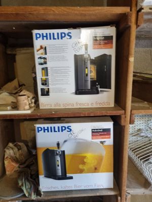 two boxes of philips coffee machines on a shelf