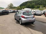 a silver car parked in a parking lot next to other cars
