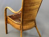 an image of a wicker chair on a grey background