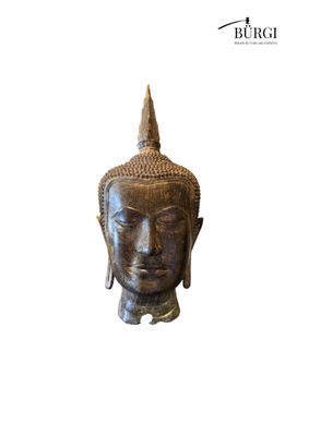 a close up of a statue of a head on a white background