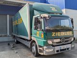 a truck that is parked in front of a building