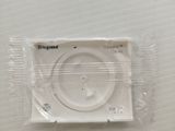 a white cd in a plastic bag on a table