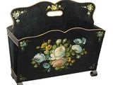 une image représentant un porte-revues noir orné de fleurs peintes