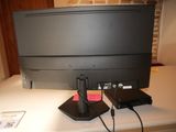 a picture of a desk with a computer monitor and a cell phone on it