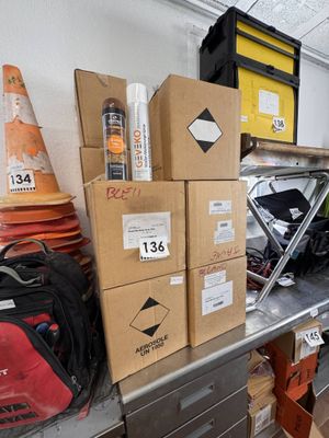 many boxes on the shelf in the garage