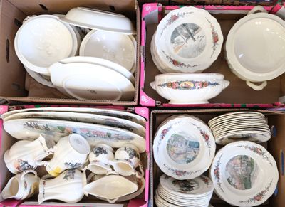 des boîtes remplies d'assiettes et de bols de toutes sortes, posées sur une table