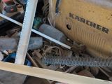 an image of a pile of junk with tools and other items