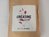 a bag of creatine sitting on a white surface