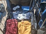 a bag of clothes sitting in the back of a truck