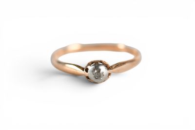 an image of a rose cut diamond ring on a white background