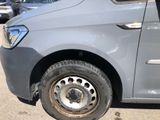 a car that has a flat tire on the side of the road