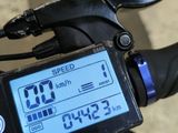 a close up of a bike with a speedometer on the handlebars