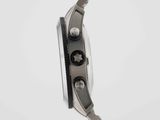 a close up of a wrist watch with a chain around it