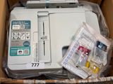 a white printer sitting in a box on a table