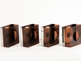 three brown boxes with a cd inside of them on a white surface