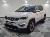 the jeep compass is parked on a checkered tile floor