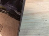 a close up of a laptop on a wooden table