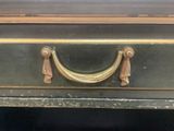 a black table with a gold handle on it