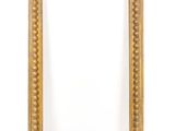 a gold frame with a decorative pattern on the edge