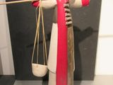 a sculpture of a woman holding a pair of scissors