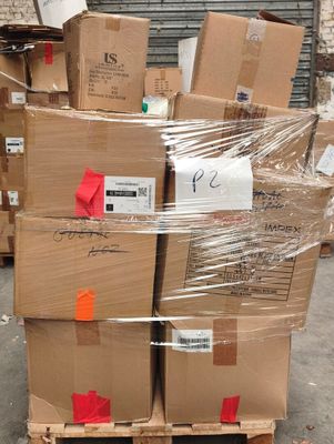 many boxes stacked on a pallet in a warehouse