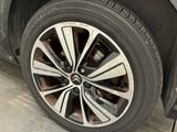a close up of a tire on a car in a garage