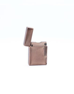 a lighter that is sitting on a white surface