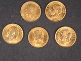 quatre pièces d'or sur lesquelles figure l'effigie d'un homme
