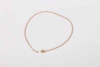 a gold chain bracelet with a tiny star charm