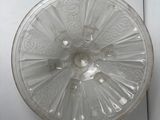 a glass plate with a design on it on a table