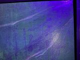 a picture of a painting on a wall in a dark room