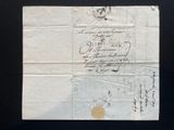 an old piece of paper with a stamp on it sitting on a table
