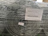 many rolls of wire wrapped in plastic on the ground