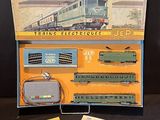 a box with a train set in it on a table