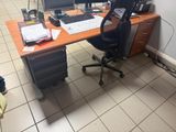 a desk with a computer monitor and a keyboard on it
