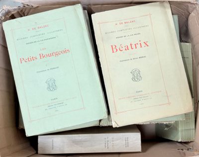 several books are in a box on top of each other