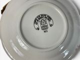 a white plate with a picture of a castle on it