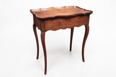 an image of a small wooden table on a white background