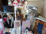 a table with many dolls and other items on it